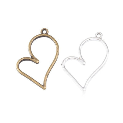 Slender open heart frames with top hanging loops arranged together on a white background.