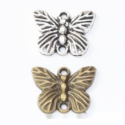 Two-loop butterfly connector metal component, grouped front view on white
