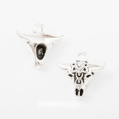 Group view of longhorn cattle skull silhouette with engraved face details