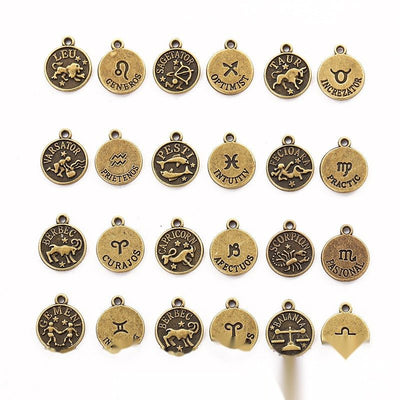 Mixed Zodiac Symbol Metal Charms in Two Finishes in multiple metallic finishes displayed together on a white background.