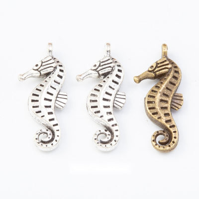 Openwork Seahorse metal pieces shown in the available finishes.