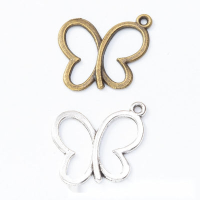 Grouped front view of outline butterfly charm showing smooth open wings and a small corner loop