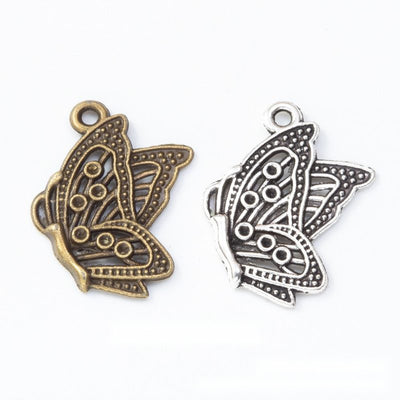 Hand-held butterfly metal component, grouped front view on white