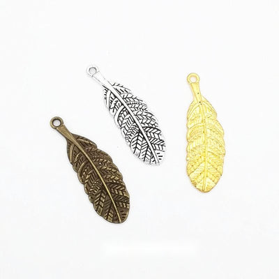 Front and finish comparison of veined feather charm
