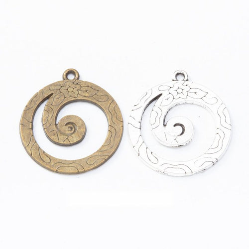 spiral wave round metal charms in two antique finishes shown together in the available finishes