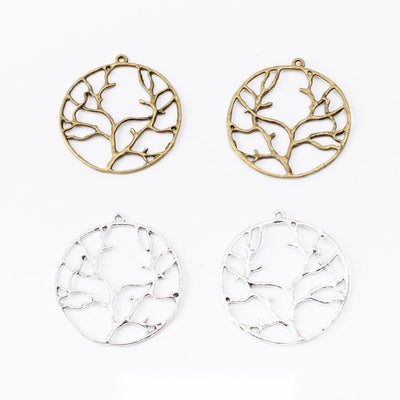 Round Branching Tree Metal Charms in Two Finishes in multiple metallic finishes displayed together on a white background