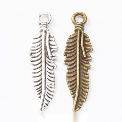 Feather Charm Pendant finish comparison showing a curved central quill and layered barbs