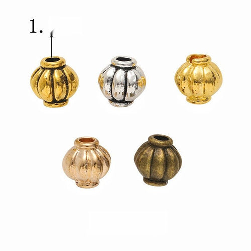 Overview of fluted lantern bead pieces on a white background