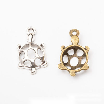 Openwork Shell Turtle metal pieces shown in the available finishes.