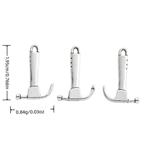 Front-facing arrangement of claw hammer charms on a white background