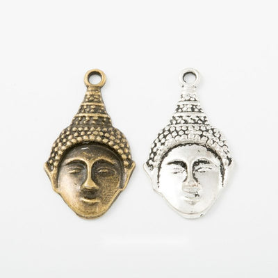Group view of Buddha head styles on a white background