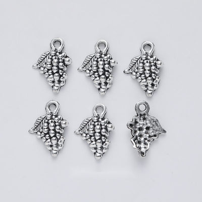 Leaf Grape Cluster Charm shown in the available metal finishes on white