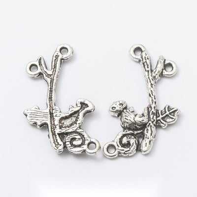 Grouped front views of the squirrel on branch multi loop silver tone connector charm