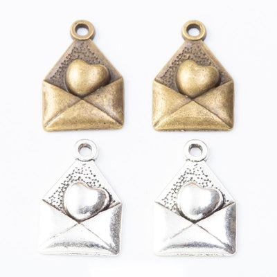 Finish comparison of 爱心信封 charm on a white background