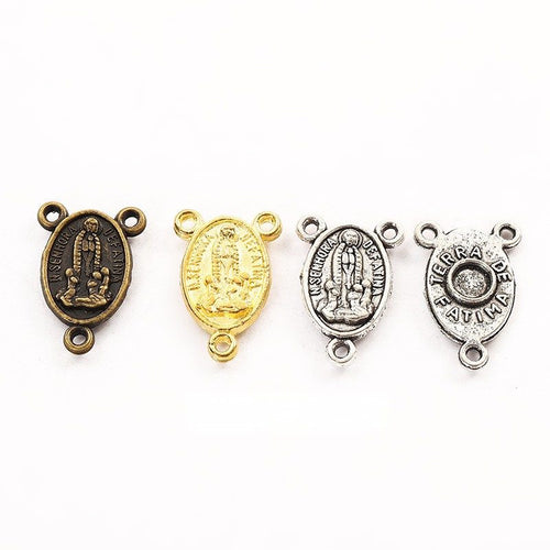 religious medal three loop metal connectors in three finishes shown together in the available finishes