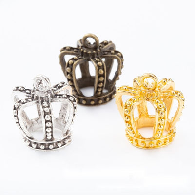 Antique Bronze, Gold Tone, Antique Silver openwork crown charm shown in an overview