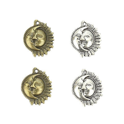 Sun and crescent moon face metal component, grouped front view on white