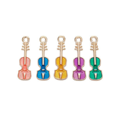 Violin metal component, grouped front view on white