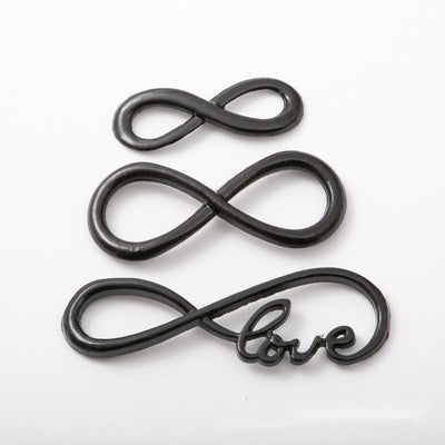 Assorted infinity link connectors arranged together on a white background