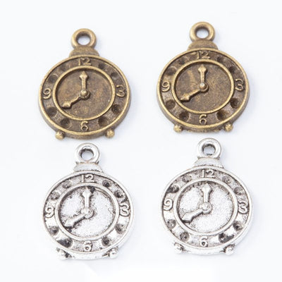 Group view of the pocket watch charm showing the available finishes and front details