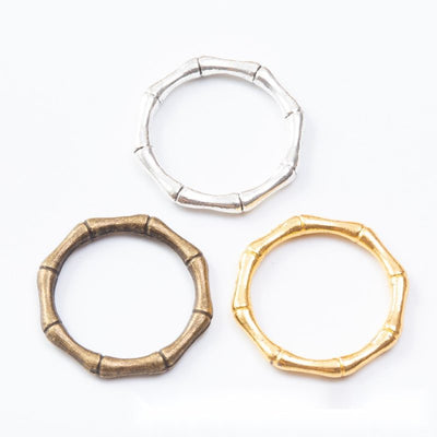 Grouped front views of the bamboo texture open ring connector in three metallic finishes