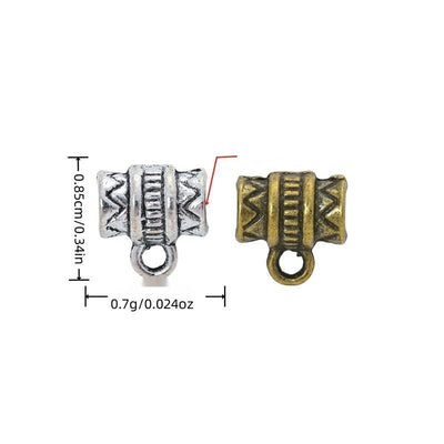 Group view of a patterned barrel bead combines a large threading hole with a lower hanging loop