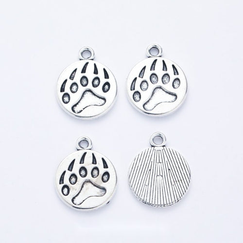 Round Bear Paw metal piece showing overall shape and available finishes
