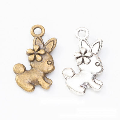 Product photo 1 of the flower rabbit charm highlighting its running rabbit with a flower beside one ear