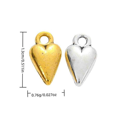 Grouped front view of puffy heart charm showing a rounded reflective face and oversized top loop