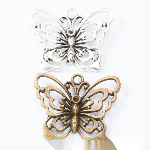 Layered Floral Butterfly Charm assortment showing the available metal finishes