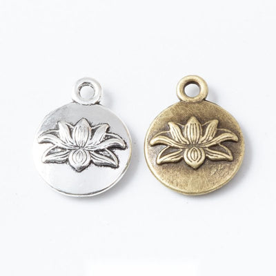 Lotus pose charm shown across the available finishes