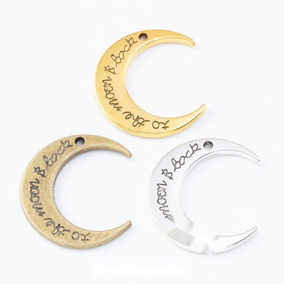 Front comparison of crescent moon with engraved lettering metal component in 3 finishes