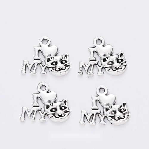 Grouped front views of the cat and my word cutout charm in available finishes