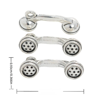 Front and reverse views of telephone receiver charms with measurement and weight guides