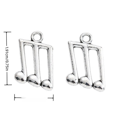 Finish overview of triple music note metal charm