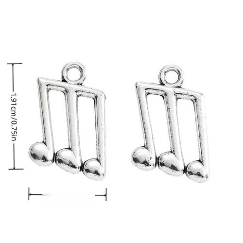 Finish overview of triple music note metal charm