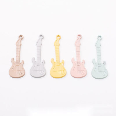 Painted Electric Guitar metal design group view on a light background