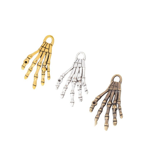 Skeletal Hand Charm assortment showing the available metal finishes
