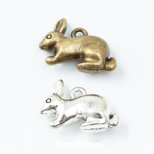 Group view of three dimensional rabbit charm on a white background