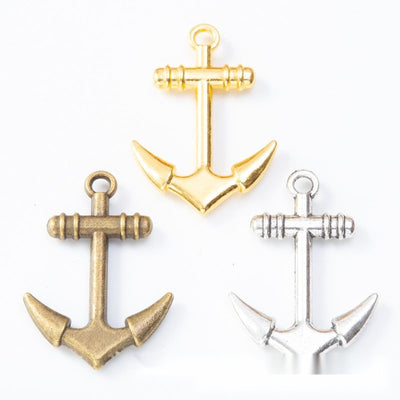 Front comparison of classic nautical anchor metal component in 3 finishes