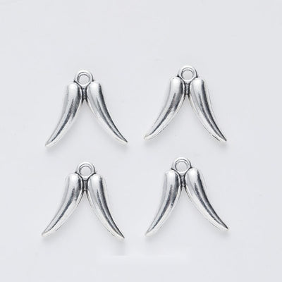 Smooth Angel Wing Charm shown in the available metal finishes on white