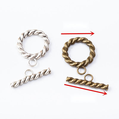 Round rope-textured toggle clasps with matching twisted bars arranged together on a white background.