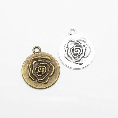 Rose medallion metal component, grouped front view on white