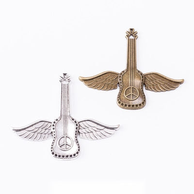 Group view of a guitar body is flanked by wide feathered wings