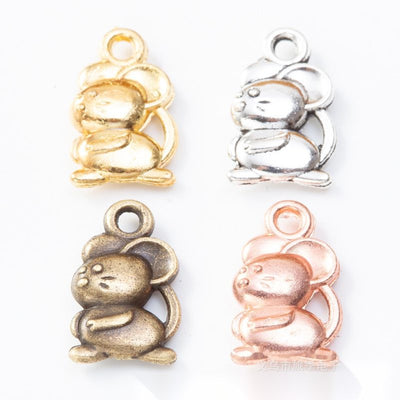 Product photo 1 of the chinese zodiac rat charm highlighting its rounded seated rat with curled tail