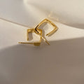 Gold Geometric Hoop Earrings with Sculpted Polished Metal Details view 3