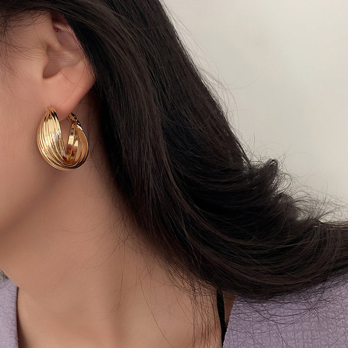 Twisted Ridged Hoop Earrings with Sculpted Polished Metal Details