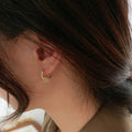 Gold Ring Charm Huggie Earrings with Sculpted Polished Metal Details view 2