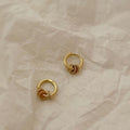 Gold Ring Charm Huggie Earrings with Sculpted Polished Metal Details view 4