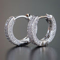 Wide Pavé Huggie Hoop Earrings in Three Metal Tones view 3
